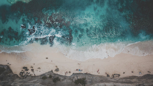 Aerial shot of a beach in Bali. [Image: Sven Piek at Unsplash]