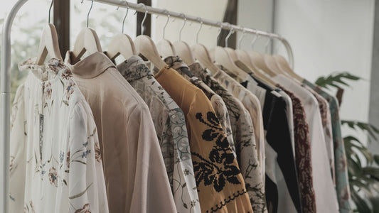 Clothing rail with garments on hangers. [Image: Aviv Rachmadian at Unsplash]
